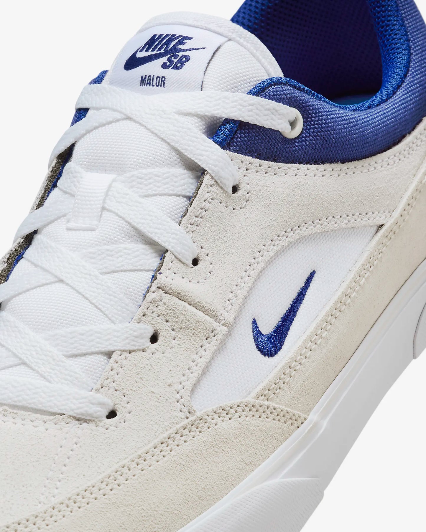 SB Malor Skate Shoes in White and Deep Royal Blue with suede and canvas upper, vulcanized sole, and herringbone grip pattern.
