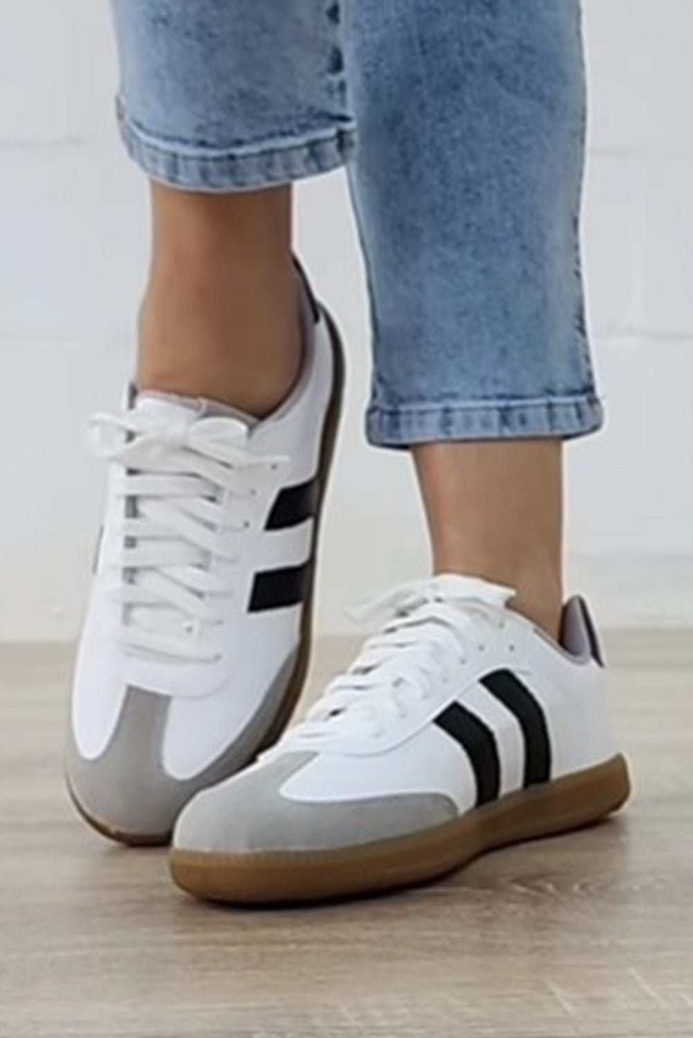 Women's white lace-up sneakers with flat sole for comfortable everyday wear