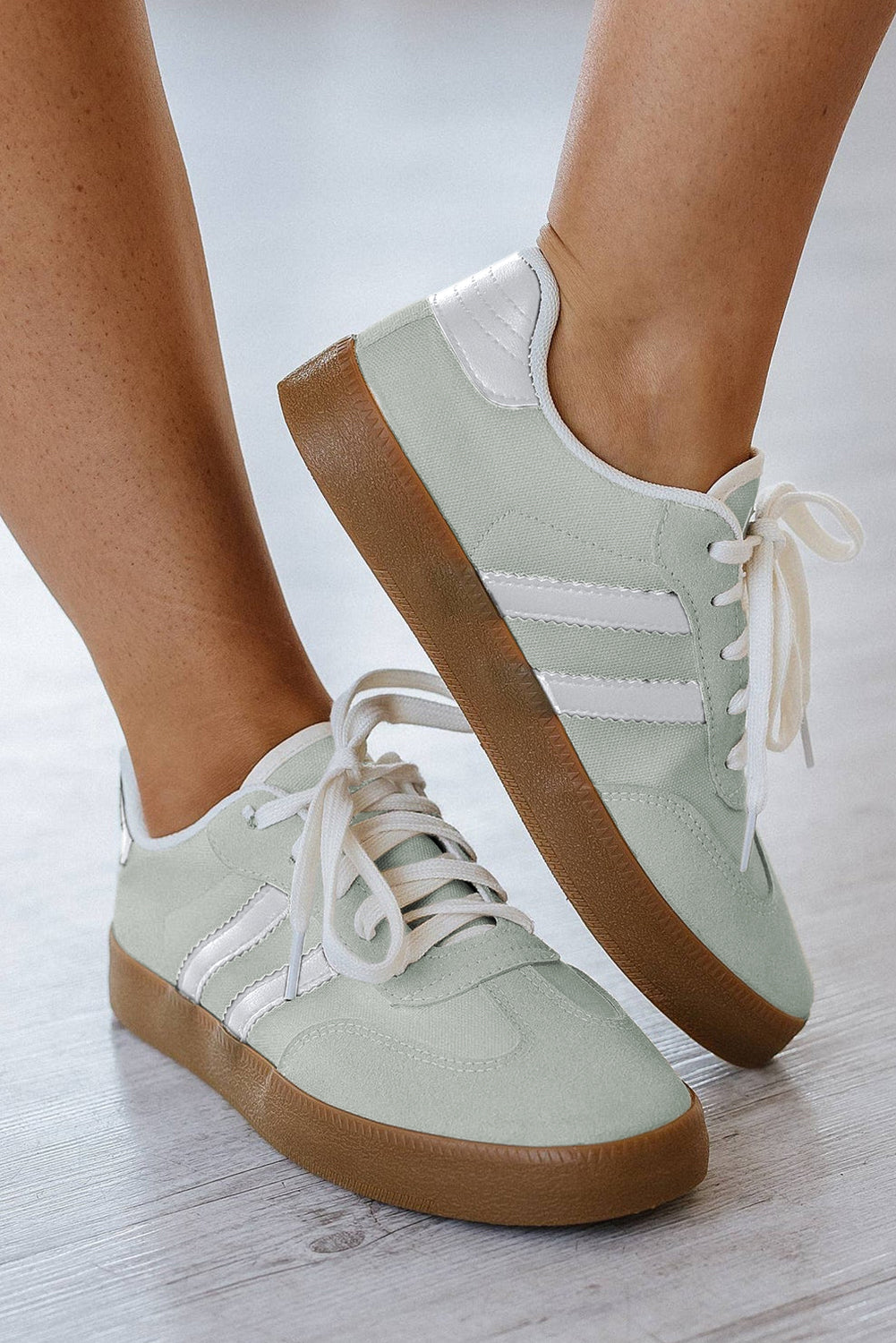 Women's white lace-up sneakers with flat sole for comfortable everyday wear - color is beau bleu