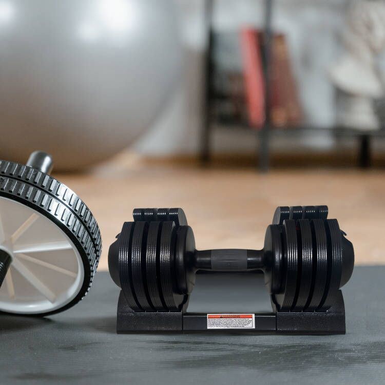 Black adjustable steel dumbbell with easy weight adjustment knob, perfect for strength and stamina training