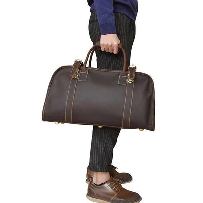 Erlend Duffle Bag made of genuine horse leather with leather handles and adjustable shoulder strap.