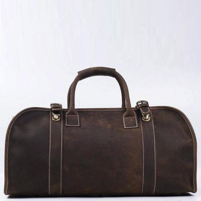 Erlend Duffle Bag made of genuine horse leather with leather handles and adjustable shoulder strap.