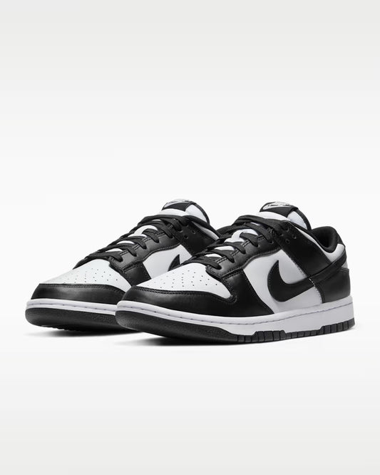 Black and white sneakers on a light gray background