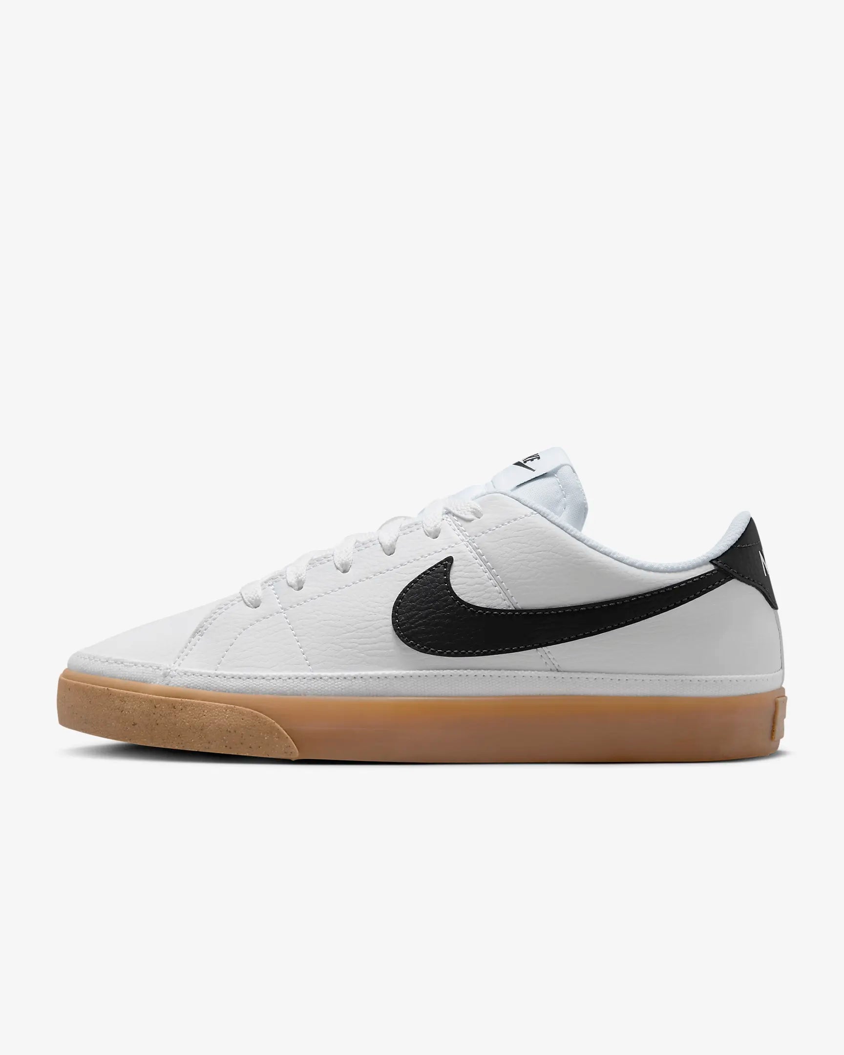 Nike Court Legacy Next Nature sneakers in white with gum yellow outsole and synthetic leather upper.