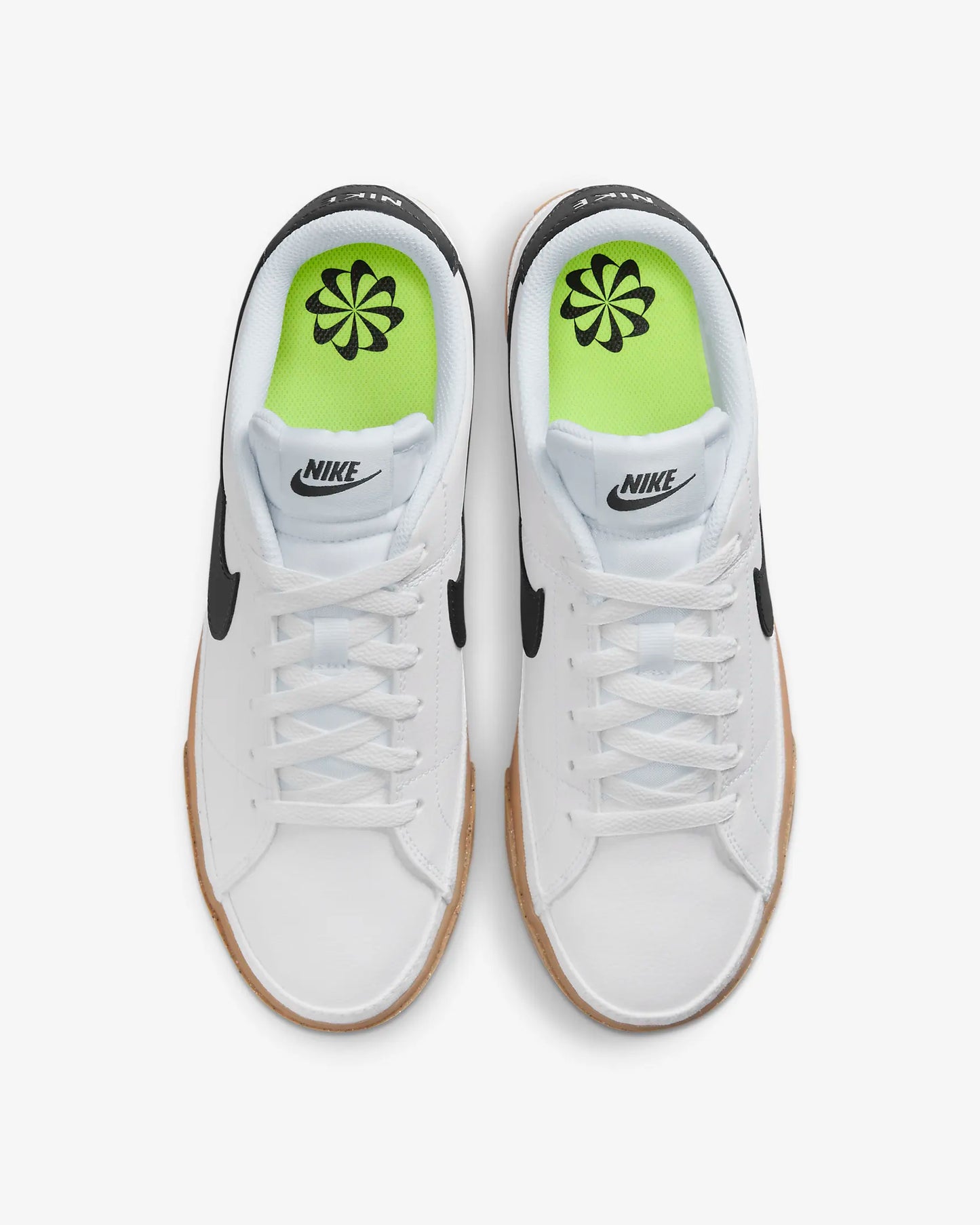 Nike Court Legacy Next Nature sneakers in white with gum yellow outsole and synthetic leather upper. Top view.