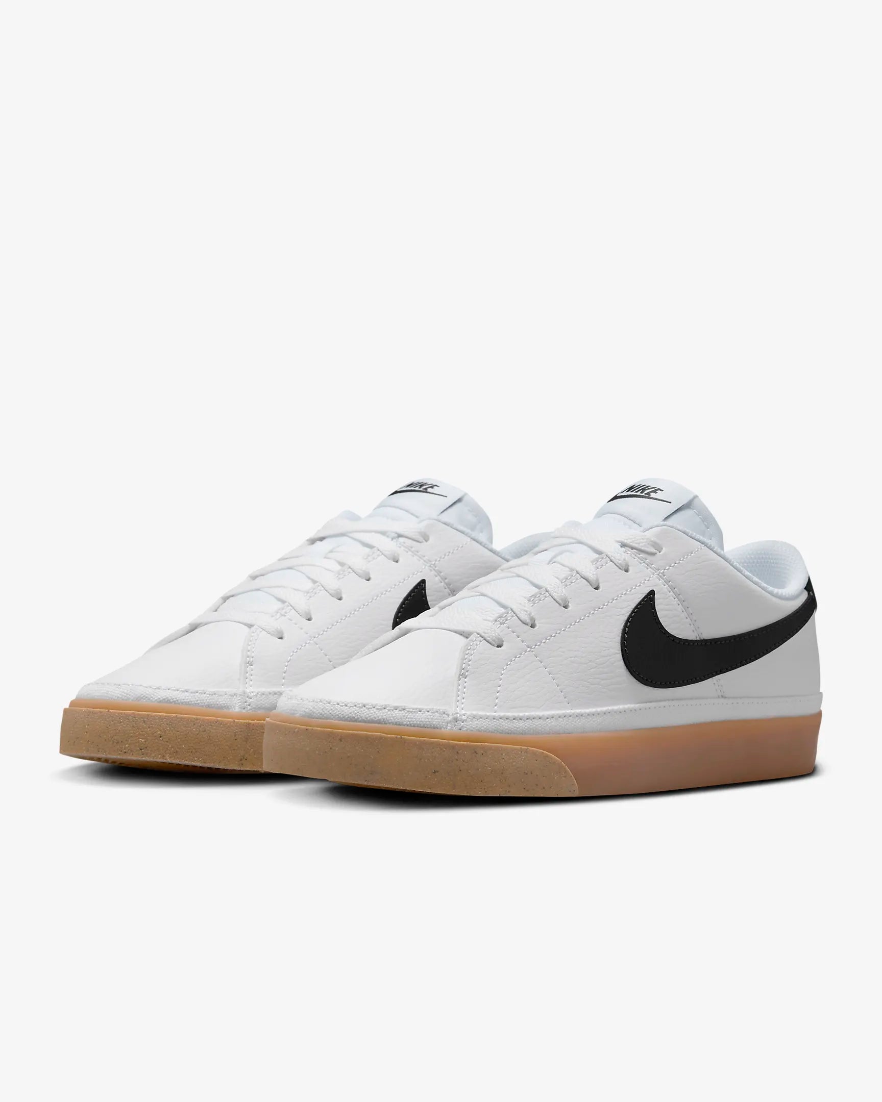 Nike Court Legacy Next Nature sneakers in white with gum yellow outsole and synthetic leather upper.