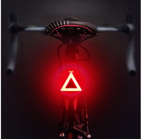 Rechargeable bicycle taillight with COB LED and USB charging, compact and lightweight design.